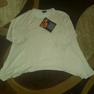 Brand new with tags. Drop shoulder top. Gold shimmer detail, relaxed fit.